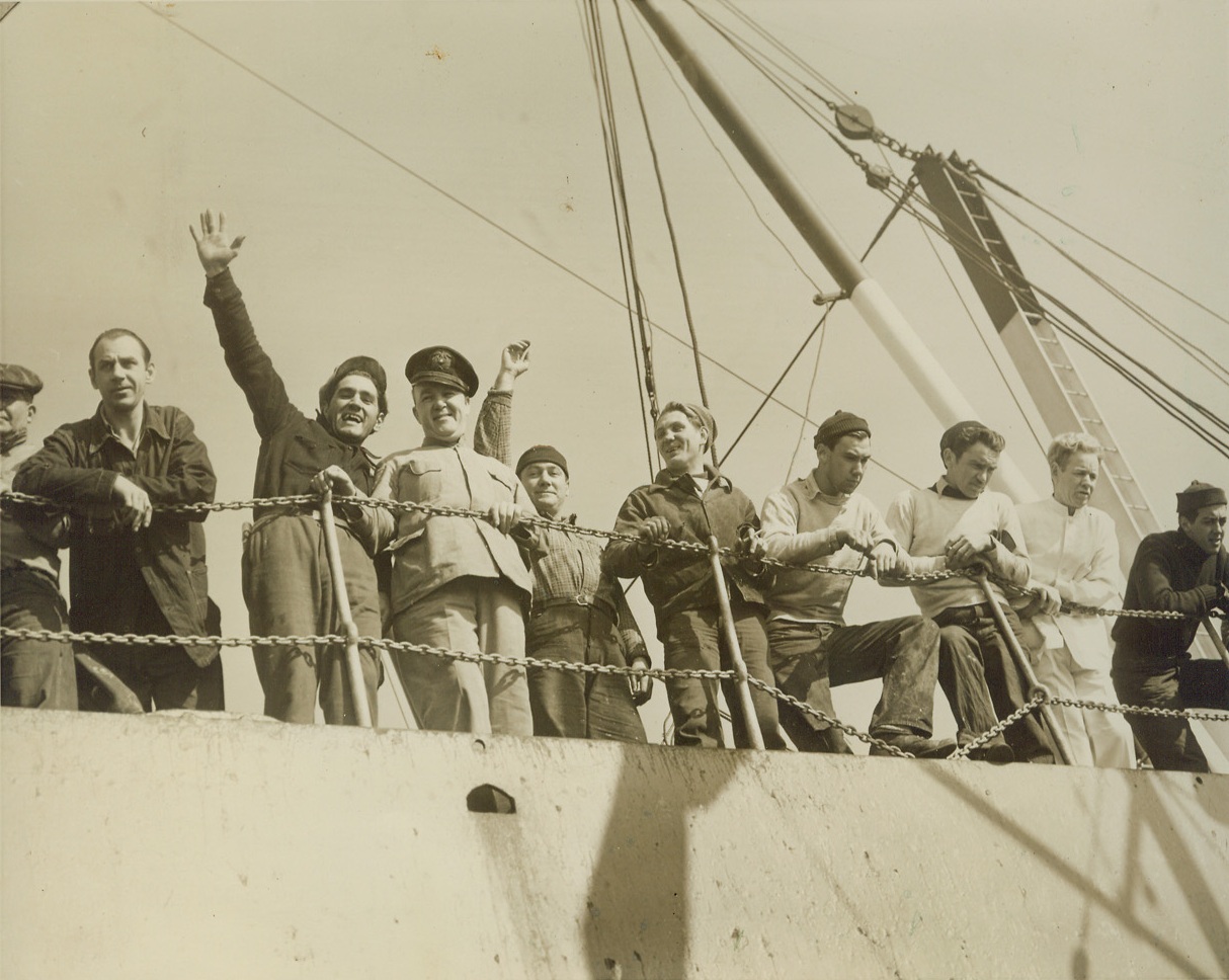 U.S. SHIP HOME FROM NORWAY, 4/25/1940  NEW YORK CITY - Members of the crew of the American Freighter Normacsea wave to friends as the ship arrived in New York Harbor April 25th. The ship, first American vessel to come from Norway since the outbreak of war there was in the port of Trondheim when the Germans took over. It crossed with a cargo of $4,500,000 in Swedish gold. Credit: OWI Radiophoto from ACME;