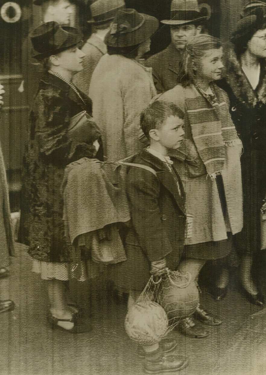 Dutch Children Arrive in London, 5/14/1940  London - Child refugees from Rotterdam and vicinity shown with their luggage and toys as they arrived in London, May 14. The Dutch High Command issued a proclamation later in the day ordering cessation of fighting on the main defensive fronts in Holland. Photo flashed from London by cable. Credit: ACME Cablephoto;
