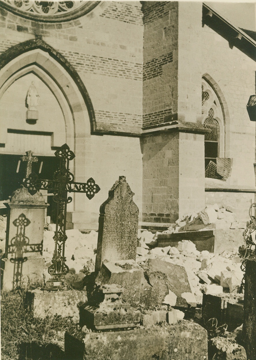 Rest In Peace, 5/29/1940  France—Resting places of living and dead alike feel the scourge of air raiders’ bombs. This church and its graveyard were battered during an air raid over a French village.  Credit: ACME;