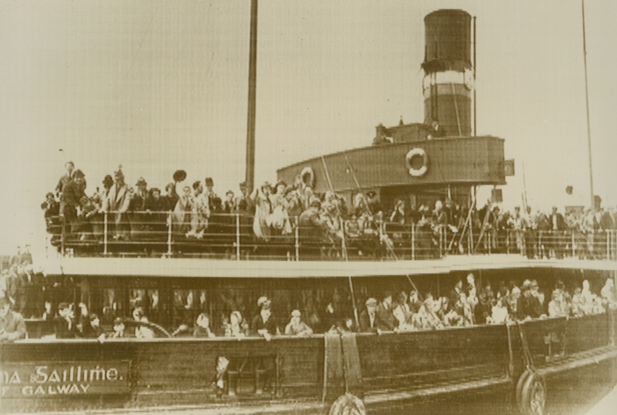 As Liner President Roosevelt Sailed for U.S., 6/2/1940  Galway, Ireland -- Some of the 824 Americans who boarded the liner President Roosevelt at Galway are shown lining the rails of the tender which carried them to the ship. Many notables were numbered among the passengers fleeing Europe’s total war. More than 100 Americans who couldn’t get passage were left behind here, but it is believed that the liner Washington, now en route to Bordeaux, would pick them up on the return voyage. Credit: ACME;