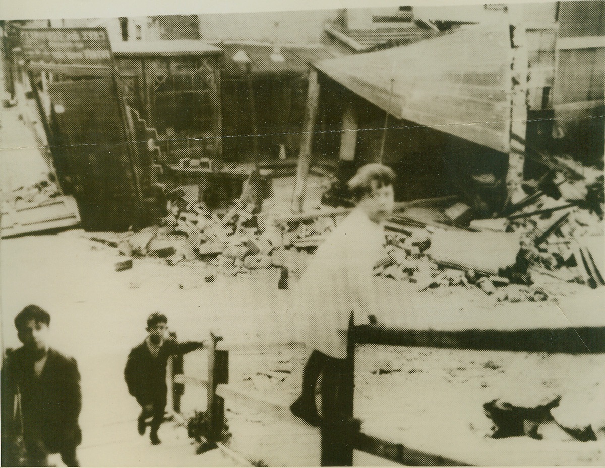 Children Play Amid Debris of Nazi Raid on Paris, 6/3/1940  Paris, France—Paris school children playing among the debris of a building wrecked in the Nazi bombing raid on Paris on June 3rd. French officials say that ten children were killed when a bomb struck a school. This picture, passed by the French censor, was flashed to New York from Paris by radio.  Credit: ACME radiophoto;