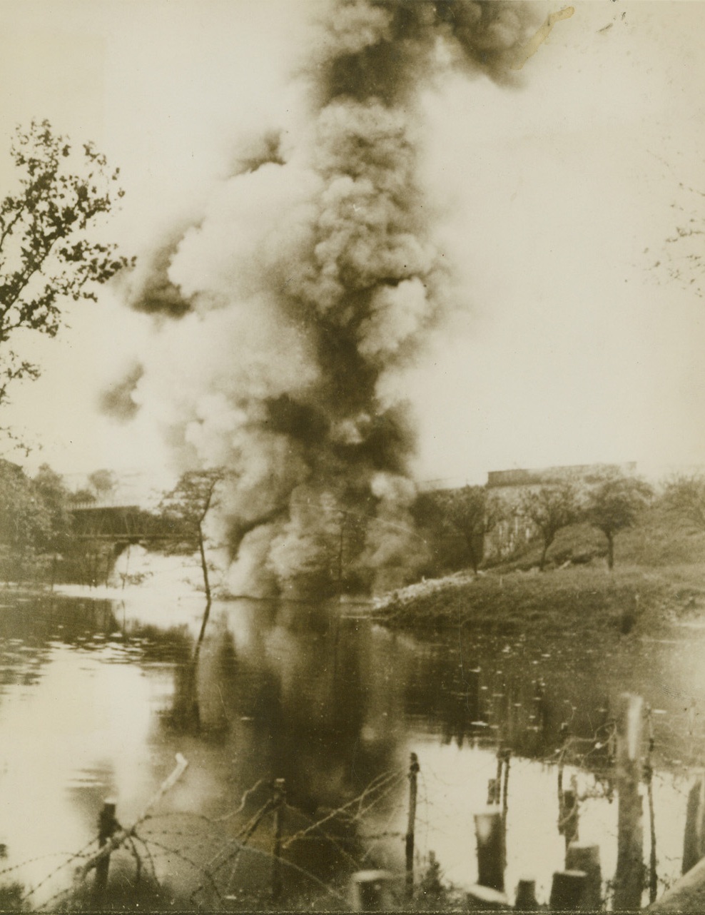 RAILWAY BRIDGE BLASTED TO HALT NAZI ADVANCE, 6/6/1940  FRANCE – A French railway bridge being blasted, presumably in an attempt to impede the German advance during the Battle of Flanders.  (Photo flown to New York by Clipper) Credit: Acme;