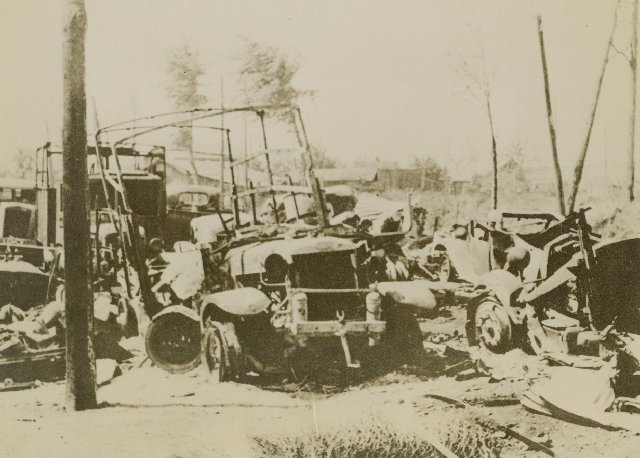 French Supply Column Bombed, 6/13/1940  FRANCE –Shattered wreckage of a French supply mechanized column, after destruction by German aerial bombardment near Peronne, according to Nazi-censored caption. Credit: Acme;