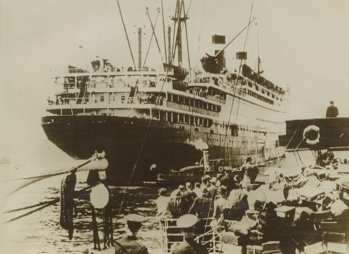 Refugee Liner Sails for U.S, 6/16/1940  GALWAY, IRELAND—The United States liner Washington leaving Galway, Ireland, with more than 1,000 American war refugees on board. The ship narrowly escaped torpedoing off the coast of Portugal, while in route from Italy to Ireland, when a U-boat stopped it. Credit: ACME CABLEPHOTO.;