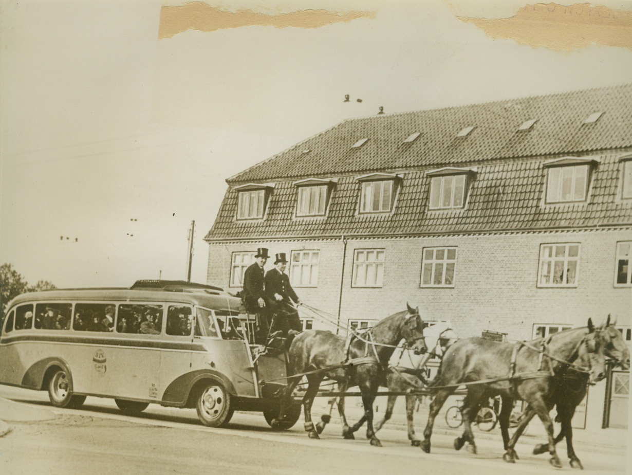 Dobbins Draws the Danes, 8/30/1940  COPENHAGEN -- To retain its business in the face of gasoline shortage, a Copenhagen bus company had coaches re-equipped in this manner to transport the population of the German-occupied Danish capital by horse-on-the-hoof-power, with top-hatted drivers at the reins. Credit: (ACME);
