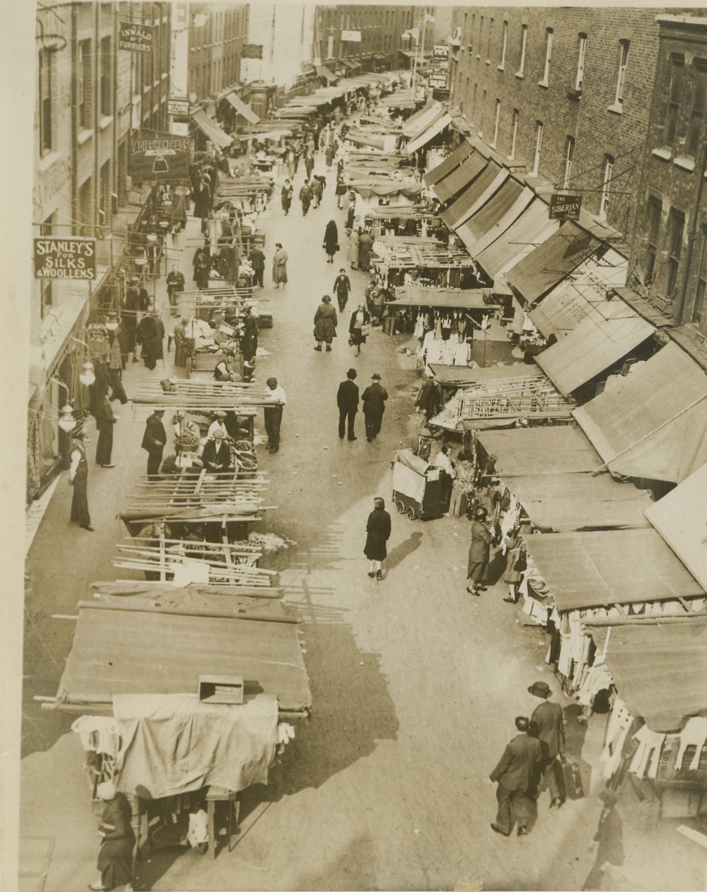 Where Bombs Wreaked Havoc in London, 9/8/1940  LONDON -- A typical street market in Whitechapel, the Jewish quarter of London's East End, where the most pitiful scenes were witnessed after the worst air raid on the British capitol last night. In this district house after house was blown to bits, with most of the occupants killed or injured. Credit: (ACME);