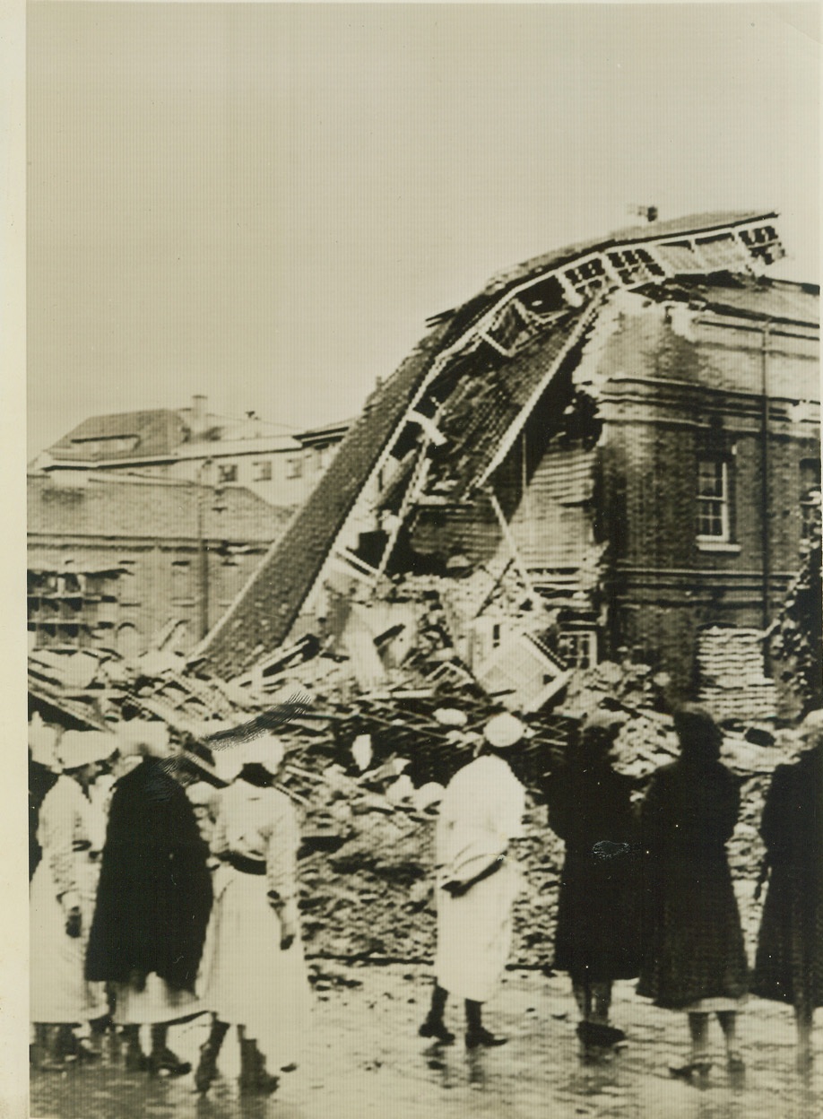 Hospital Wrecked by Nazi Bombs, 9/17/1940  LONDON -- Nurses view the wreckage of an unnamed hospital which was completely smashed during the fury of Germany's most intense air attack on the British capital, Sept. 16. Photo passed by censor and cabled to New York. Credit: (ACME);