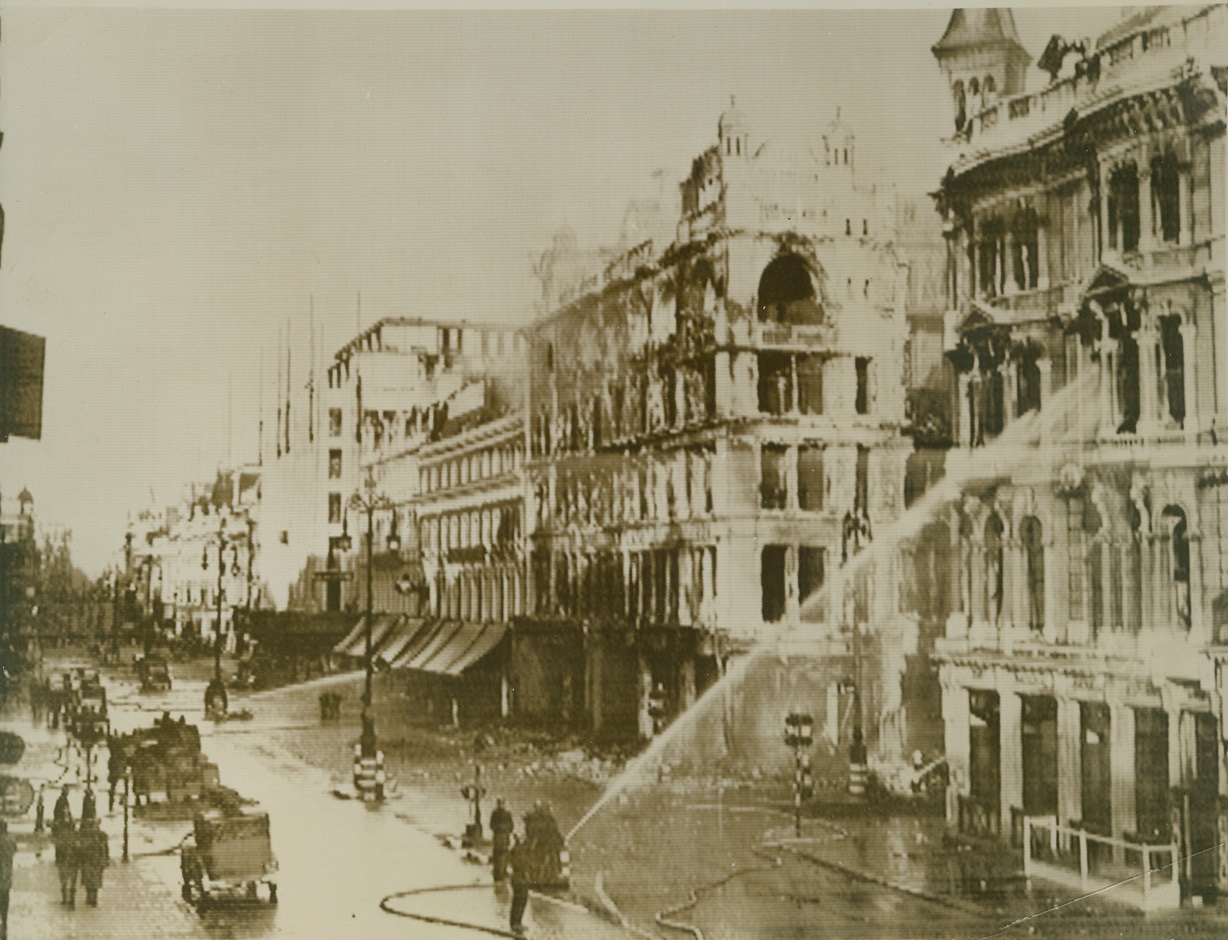 Bombs Crash In London's Shopping Center, 9/18/1940  LONDON -- Bombs and fire, resulting from German air attack Sept. 17, destroyed many of the city's most fashionable department stores, located in Oxford street. This general view, cabled from London to New York, shows the extent of the attack as felt in Oxford Street. Credit (ACME Cablephoto);