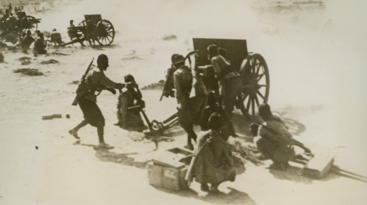 Libyan Barrage, 9/23/1940  Libya – Italian native artillery in action in Libya.  A recent report states that the Italian troops that advanced into Egypt from Libya filled the town of Sidi Barrani, Egypt, when it was blown to bits by land mines set off by retreating British. Credit Line (ACME);