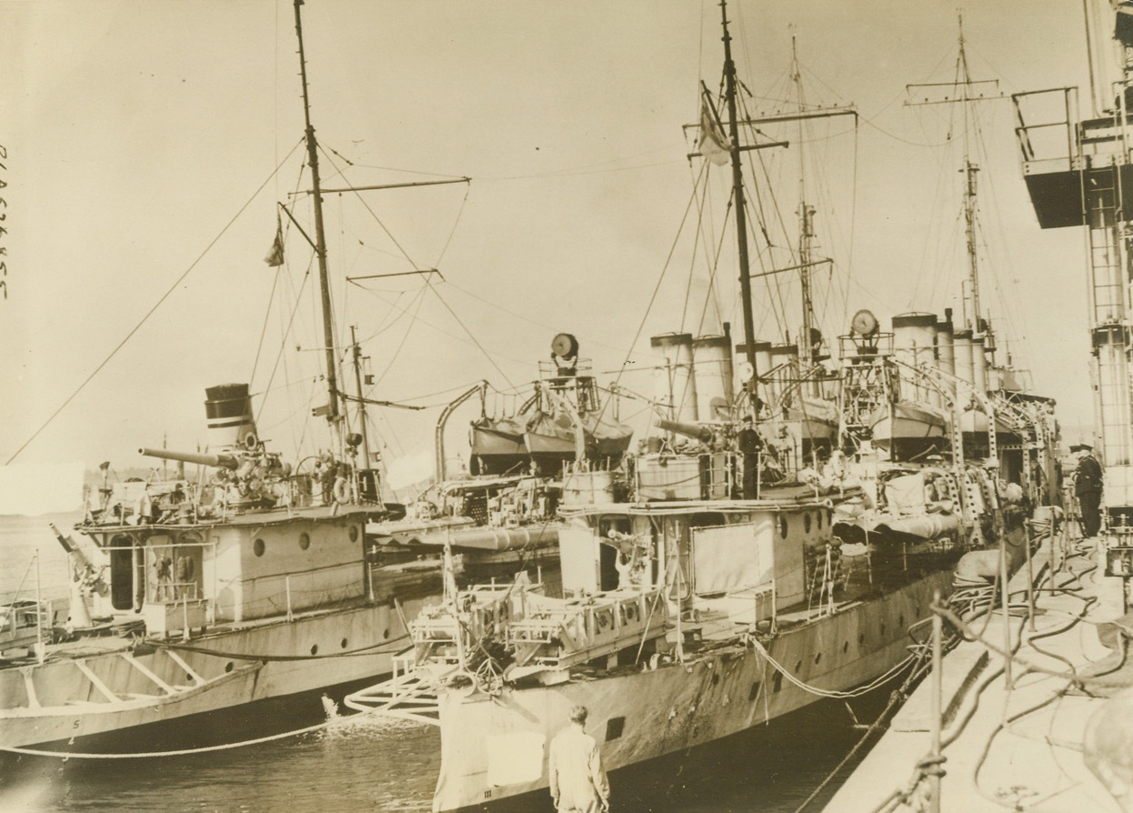 FIRST U.S. DESTROYERS ARRIVE IN BRITAIN, 10/4/1940  A BRITISH PORT—Ships of the first flotilla of the 50 U.S. destroyers transferred to Great Britain under the ships-for-bases exchange deal to cross the Atlantic under the White Ensign, ride at anchor here after their arrival. Officers and men declared themselves well satisfied with the performance of the vessels on the crossing. Credit Line (ACME);