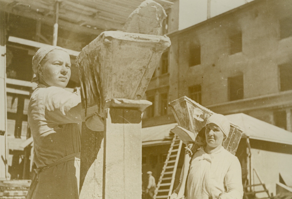 Finland Rebuilds, 10/11/1940  HELSINKI, FINLAND—As Europe is razed by devastating air raids, Little Finland is busy rebuilding, repairing similar havoc wrought by the military claws of the Russian Bear when it came lumbering into the frozen north. This photo shows some of the hardy Finnish women who are working as hod carriers for brick-layers busy rebuilding in Helsinki. Credit: ACME.;