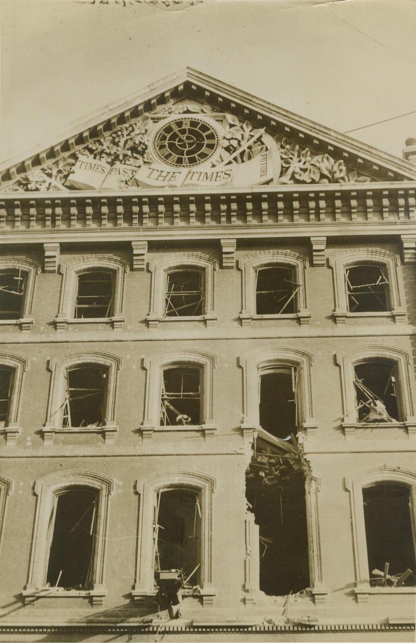 London Newspaper Office Hit, 10/18/1940  LONDON -- The building housing the London Times, one of the world's outstanding newspapers, was a victim of one of Germany's night air raids on the central London area. The building is located in Queen Victoria Street. Credit: (ACME);