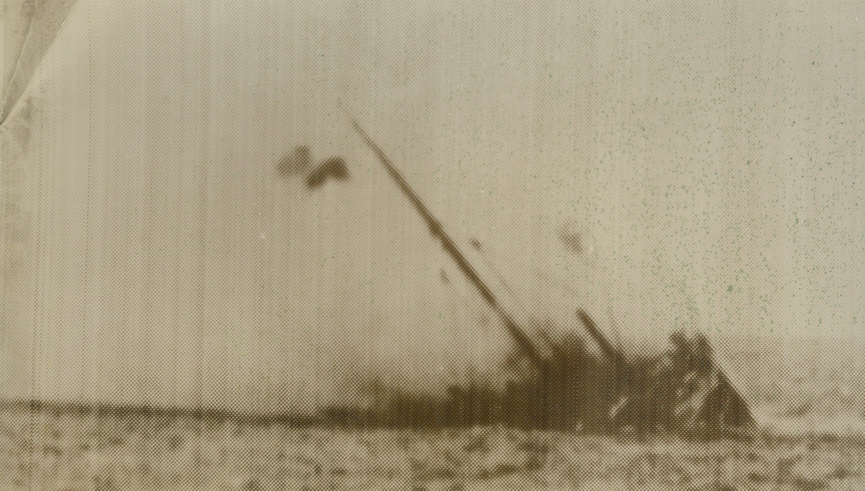 AUXILIARY CRUISER SUNK BY NAZIS, 11/8/1940  According to the German censor, this picture, radioed from Berlin to New York, shows a British auxiliary cruiser just before it plunged into the sea after a battle with a German warship. The German High Command, in a recent communiqué, reported destruction of 86,000 tons of British shipping in the North Atlantic.Credit: Acme Radiophoto;