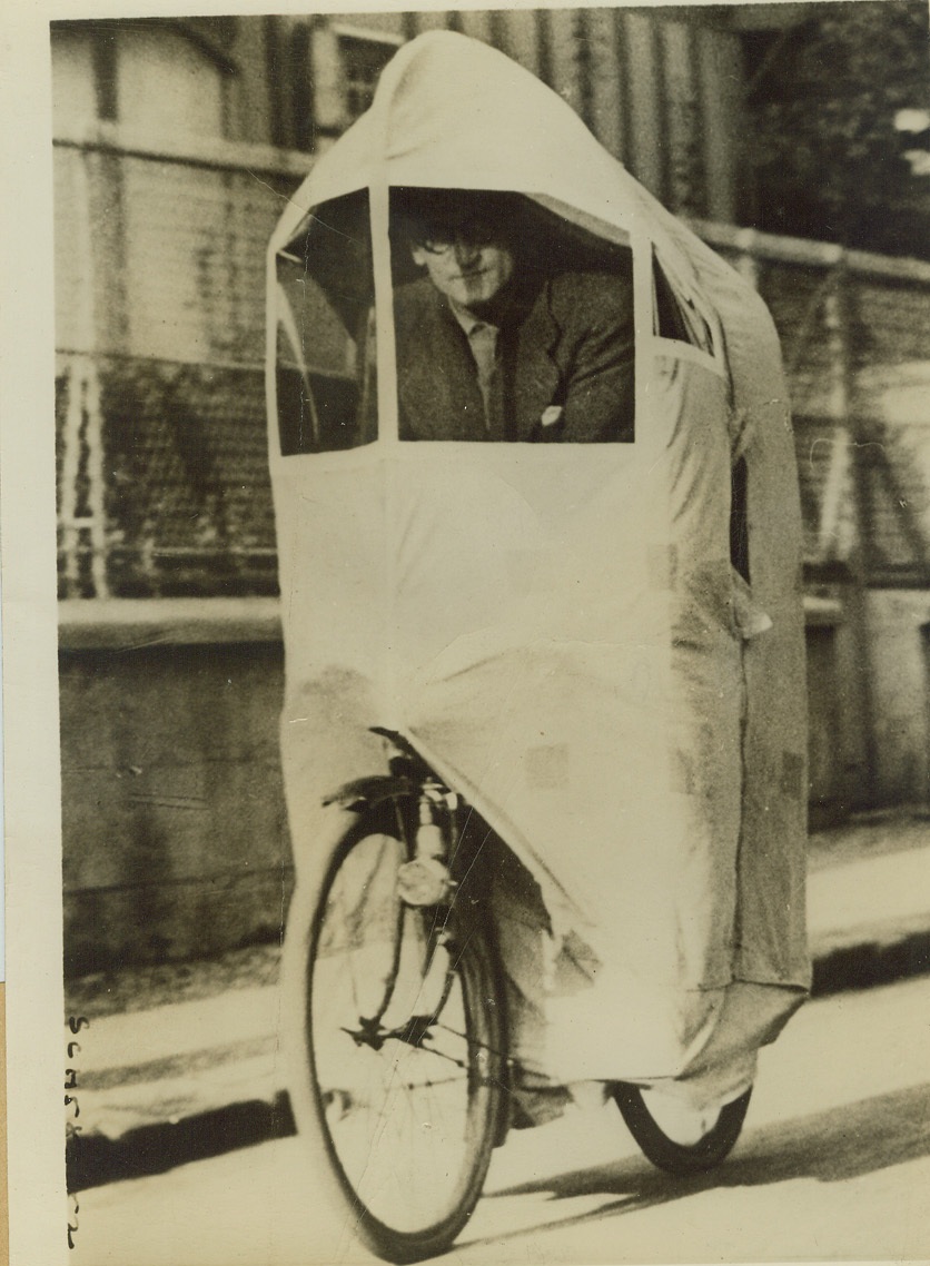 Occupation Taxes French Ingenuity, 11/25/1940  PARIS -- Shortage of fuel in Paris has worked many changes in living, working and travel habits since the German occupation. Faced with the prospect of having to use his bicycle through the winter, in rain or shine, this ingenious Frenchman constructed a shelter on it to protect him from the elements. Credit: (ACME);