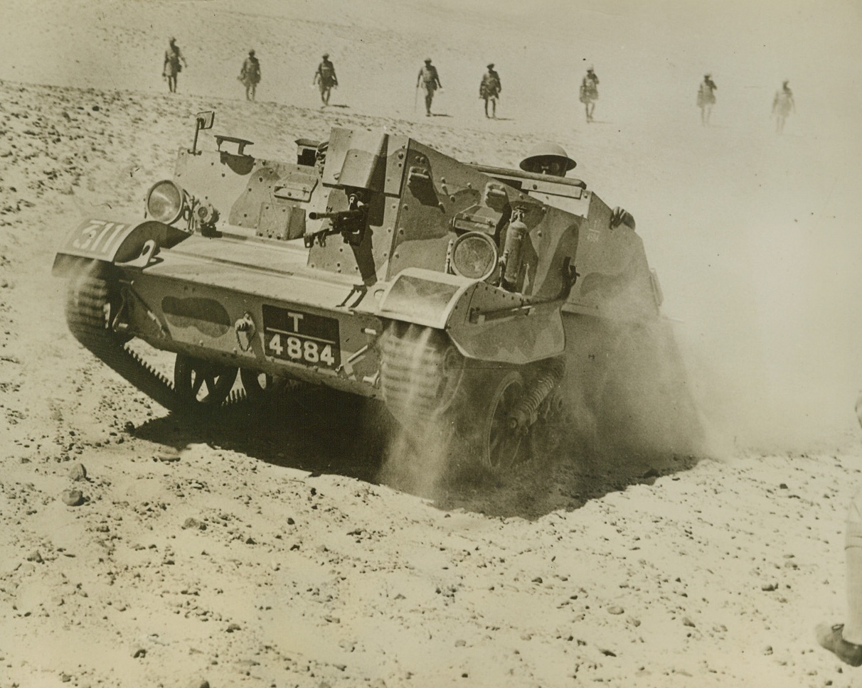 Driving Italians Out of Egypt, 12/12/1940  Desert – With Indian troops, like these shown advancing behind a Bren gun carrier, plays an important part in the fighting, the British forces in Egypt have driven the Italian invaders from practically all of the Egyptian coastline and are forcing them back toward Libya with tremendous losses in men and materials. Credit line (ACME);