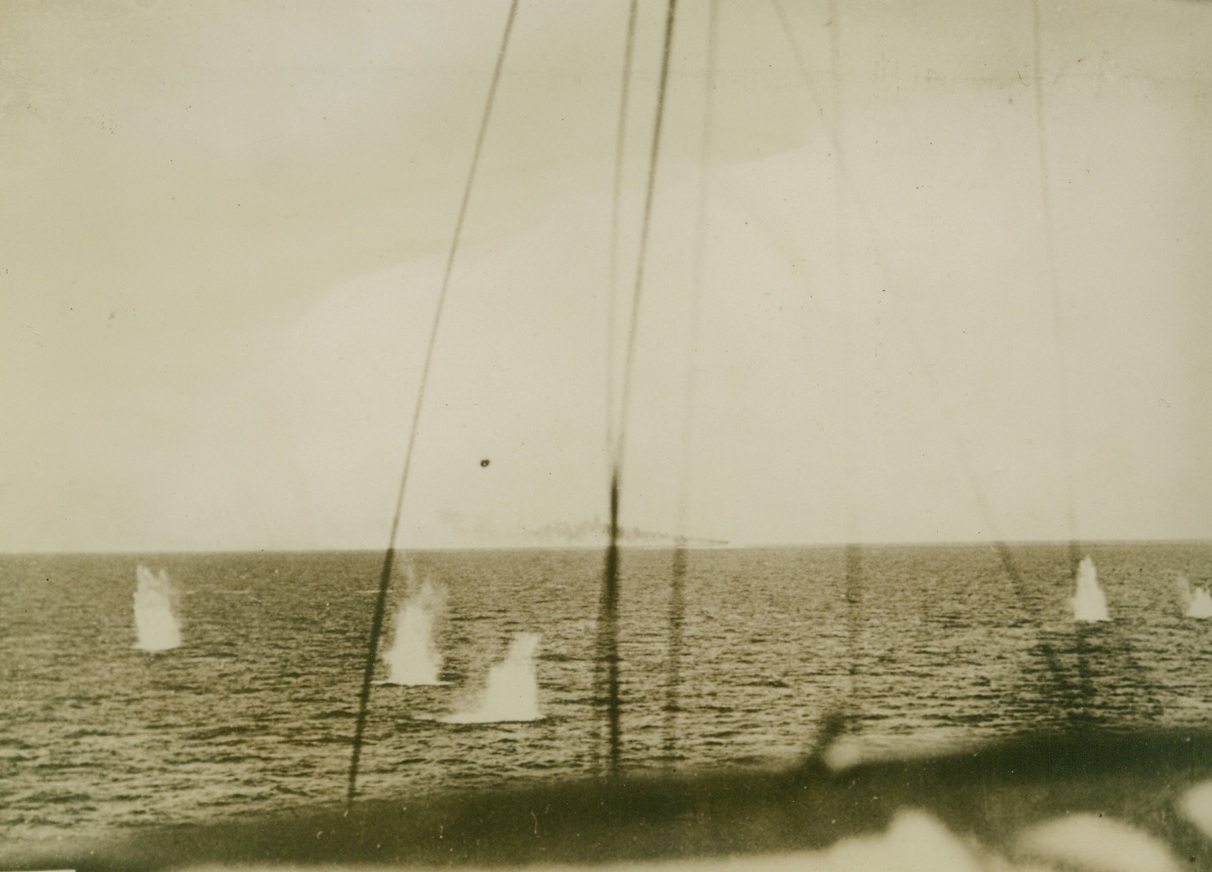 Italian Ship Dodges British Shells, 12/17/1940  SARDINIA – Shells from a British warship drop perilously near an Italian ship during a naval engagement off the south coast of Sardinia. Credit Line (Acme);