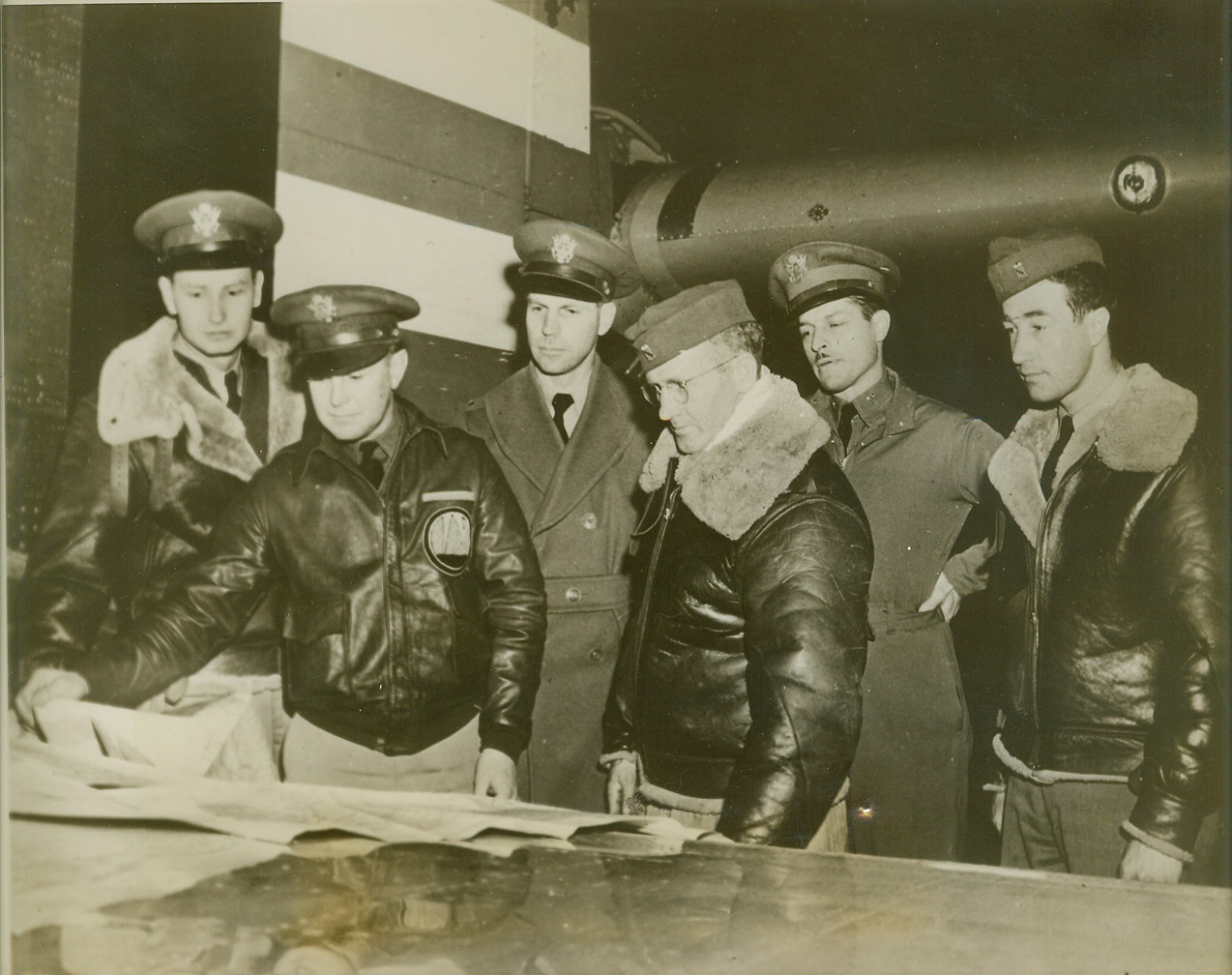 Test “Flying Fortress” Endurance, 1/5/41  DAYTON, OHIO – Crew of Boeing B 17 army bomber checking route of 15 hour 3000 mile endurance test, longest nonstop non refueling flight ever attempted by army air force, shortly before take-off from Patterson field at Dayton, Ohio. Left to right: Lieut. G.E. Glober, Lieut P.F. Davis, Lieut M.M. Munn, Sgt. H.A. Lindle, Capt. O.O. Benson, Sgt. E.W Meeker. Please credit “ACME”;