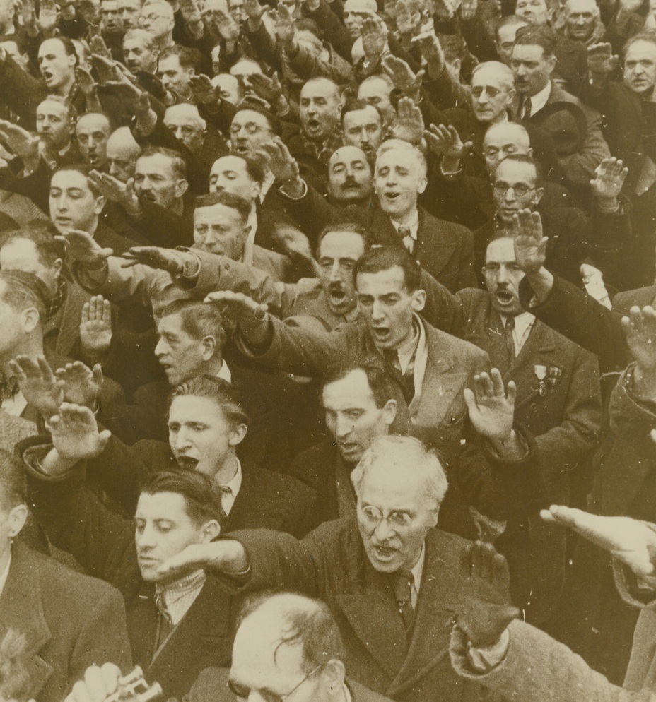 Veterans Swear Allegiance to Petain, 1/7/41  Lyon, France—Massed French war veterans raised their right arms as they swear allegiance to the regime of Marshall Petain during the great welcome accorded the French Chief of State during his recent visit to Lyon. Passed by French censor. Credit: ACME.;