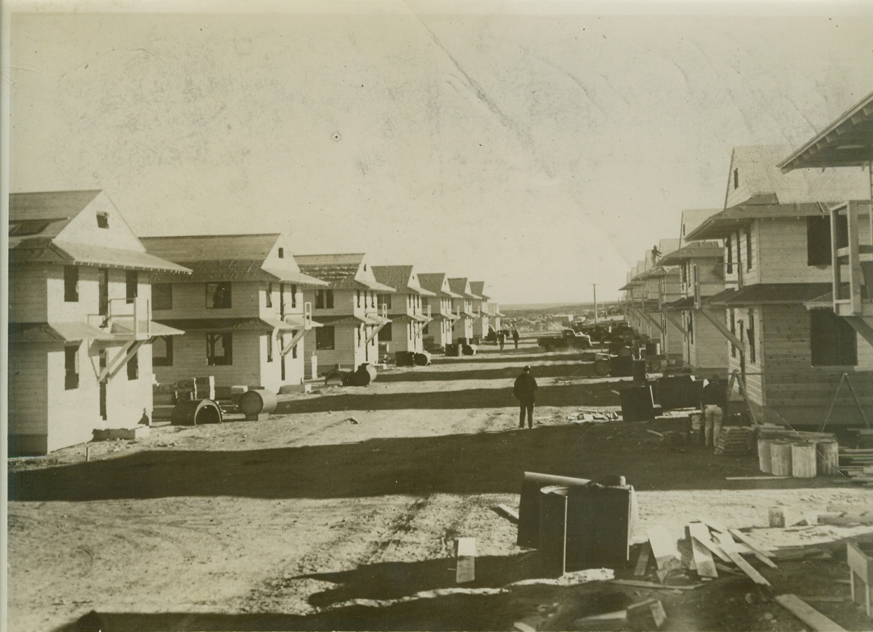 CONSTRUCTION OF ARMY BARRACKS AHEAD OF SCHEDULE, 1/14/41  FORT WARREN, WYO. – Part of 300 buildings under construction at Ft. Warren, Wyoming, which will be finished by March 1, far ahead of schedule. The barracks are being built at a cost of $1,500,000, and will house 8,000 conscriptees. The cantonment occupies territory adjacent to present post buildings, which, prior to Nov. 1, was virgin prairie. Credit: OWI Radiophoto from ACME;