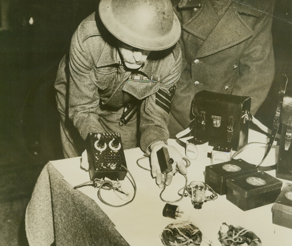 BRITAIN EXECUTES “RADIO SPIES”, 1/14/41  LONDON—Here are the dismantled radio sets with were found on the persons of Jose Waldberg, 25-year-old German from Mainz, and Karl Meier, 24, a Dutch subject of German origin, when arrested by British authorities. Under the Treachery Act the men were found guilty of being spies and hanged at Pentonville Prison.Credit: Acme;