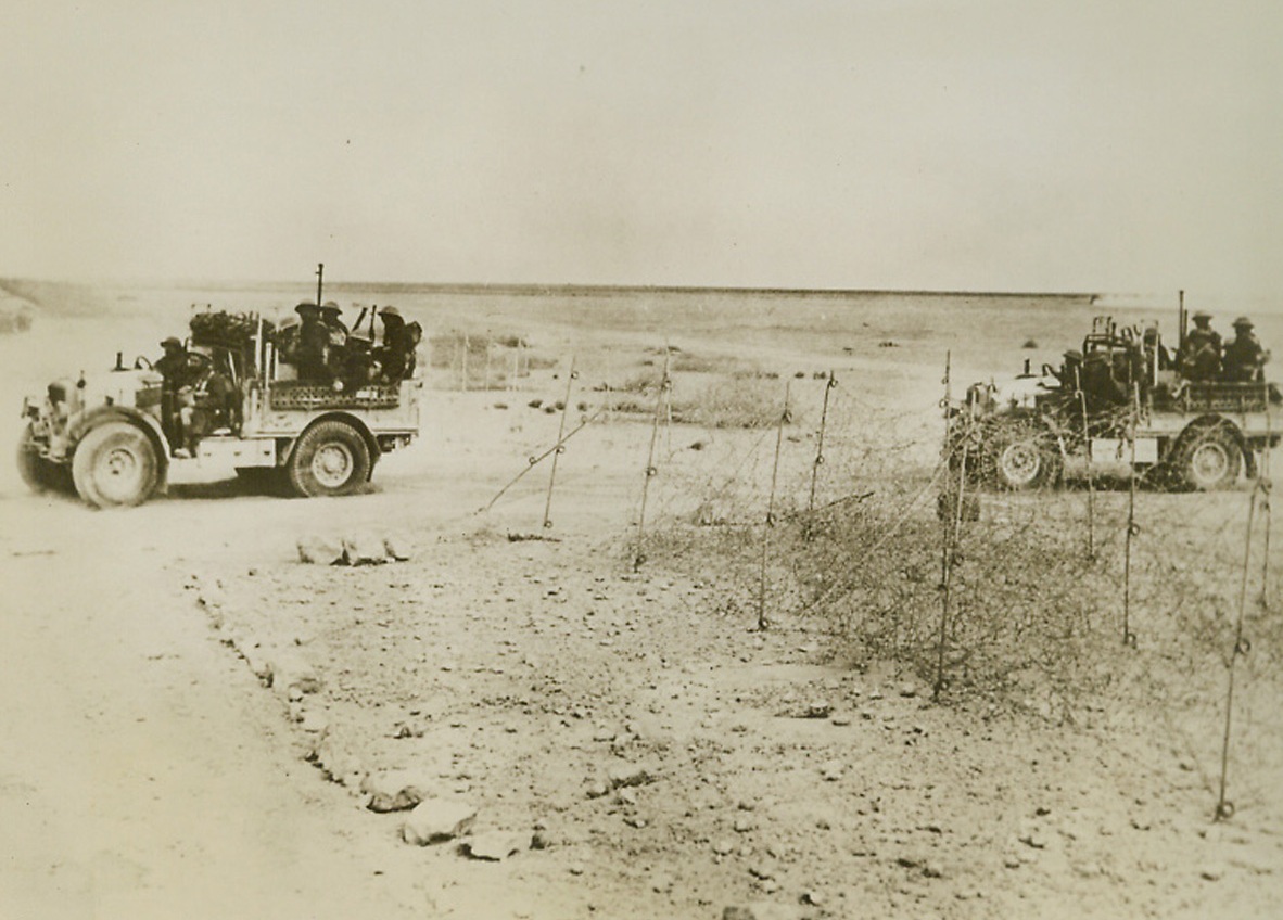 Free French Aid in Fall of Bardia, 1/25/41  Bardia—Contributing to the fall of Bardia were these Free French forces, seen riding toward the former Italian desert stronghold in British trucks. Credit: ACME.;