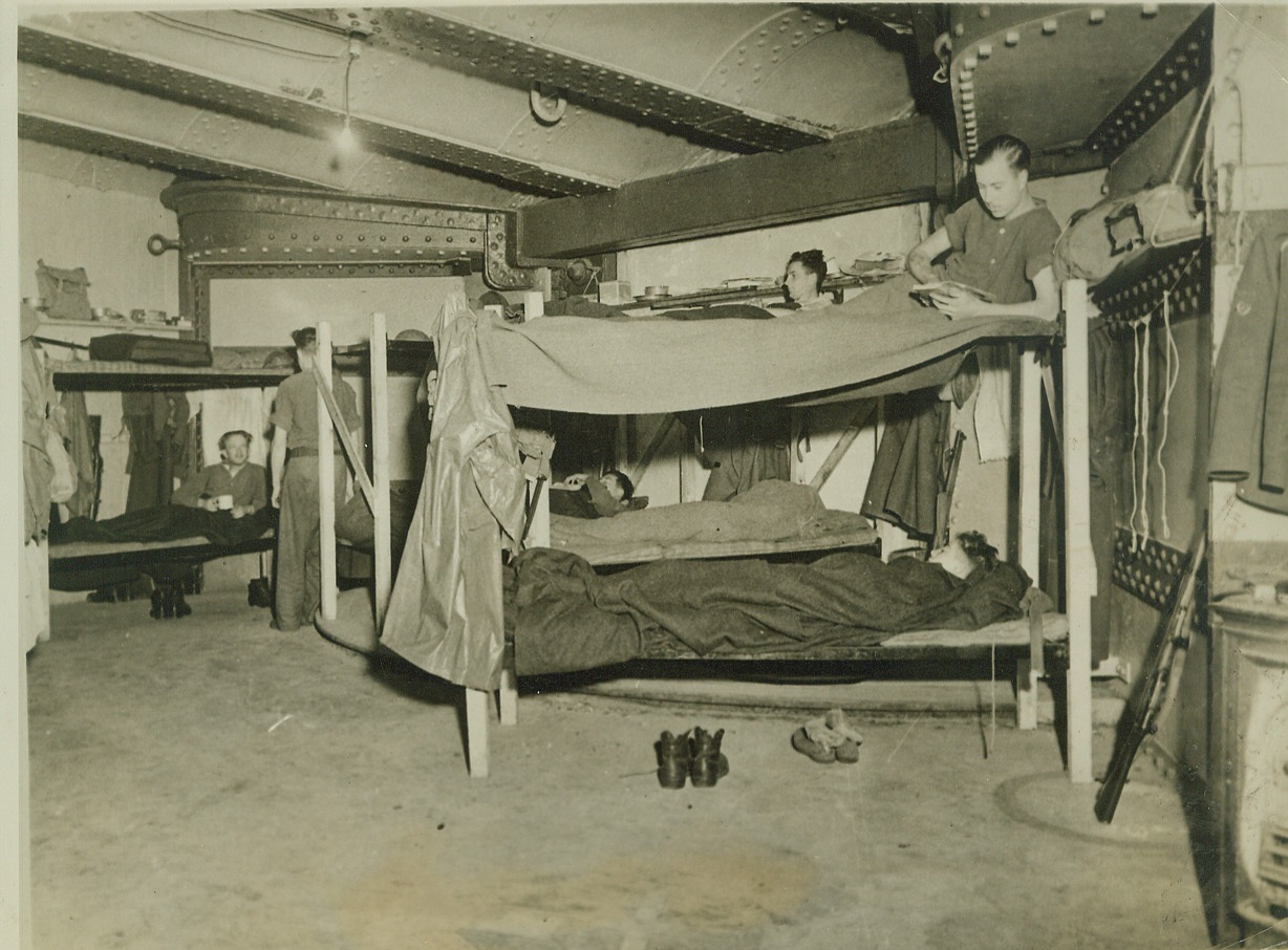 Life in a British Sea Fort, 2/5/41  ENGLAND -- Men off duty in a sea fort of the Southern Command rest in their bunks in the fort's living quarters. These sea forts, huge structures of steel and concrete which bristle with guns, are anchored off shore and are jointly manned by Army and Navy personnel.  Credit: (ACME);