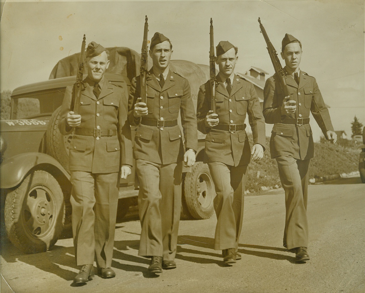 Four of a Kind, 2/6/41  FORT MAC ARTHUR, SAN PEDRO, CALIF. – We’re in the Army now and like it. Such is the talk of the four Carson brothers. Wayne, Samuel and Alfred Carson enlisted last October. The fourth just joined up, and now they plan for the fifth brother to enlist. Photo shows: (left to right) William L. 28, Wayne Q. 25, Samuel M. 20, and Alfred J. Carson, 18. The brothers are members of the 69th Quarter master Battalion at Fort MacArthur. Credit: (ACME);