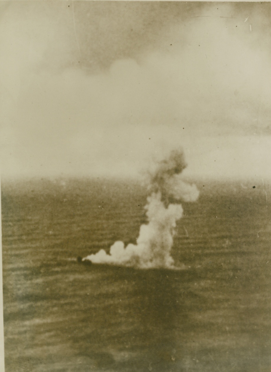 HOW GERMANY WARS ON BRITISH SHIPPING FROM AIR, 3/16/41  GERMANY – The stricken British freighter settles beneath the waves, a cloud of smoke marking her resting place, according to the German censor-passed caption on this picture of how long-range German bombers are striking at Britain’s shipping lifeline. Credit: ACME;