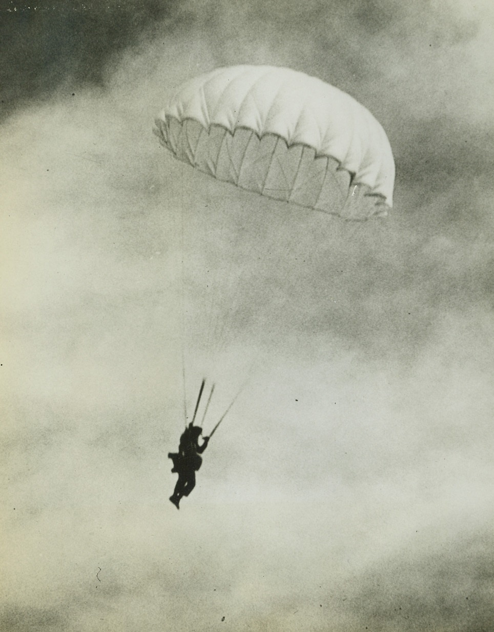 Gale Stops Parachute Record Attempt, 10/14/41  Rapid City, S.D. – Buffeted by high winds, George Hopkins, the mermit of Devil’s Tower, drops to earth in his parachute as he attempts to set new World’s Record for successive parachute jumps at Rapid City, S. D. The gale forced him to abandon the idea after 14 leaps. Credit: ACME;