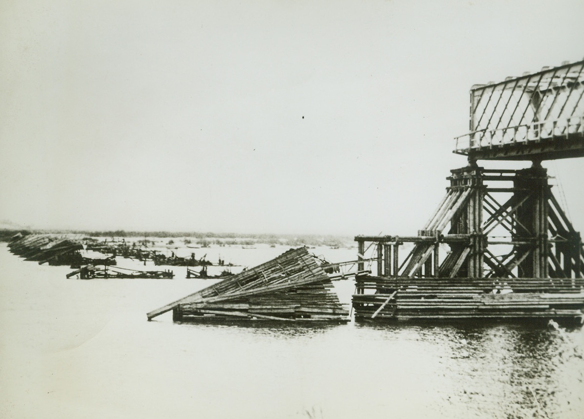 Calm “After” the Storm, 10/24/41  RUSSIA—All was calm when German forces arrived at this scene on the Dneiper River at Strassolessnje. Retreating Soviet forces destroyed the bridge to slow up the Nazi advance. Passed by German censor.Credit: ACME;