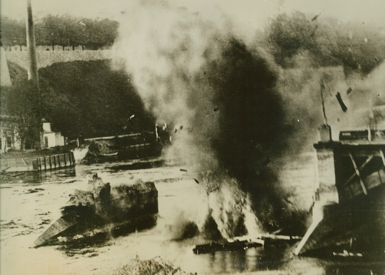 Destroying to Repair, 10/24/41  Russia—German engineers caused this geyser when they blasted a piece of bridge framework as they went to work repairing a destroyed bridge across the Narva River. The bridge was blasted by retreating Red Army troops to stop the advance of the Germans. (Passed by German censor). Credit: ACME.;