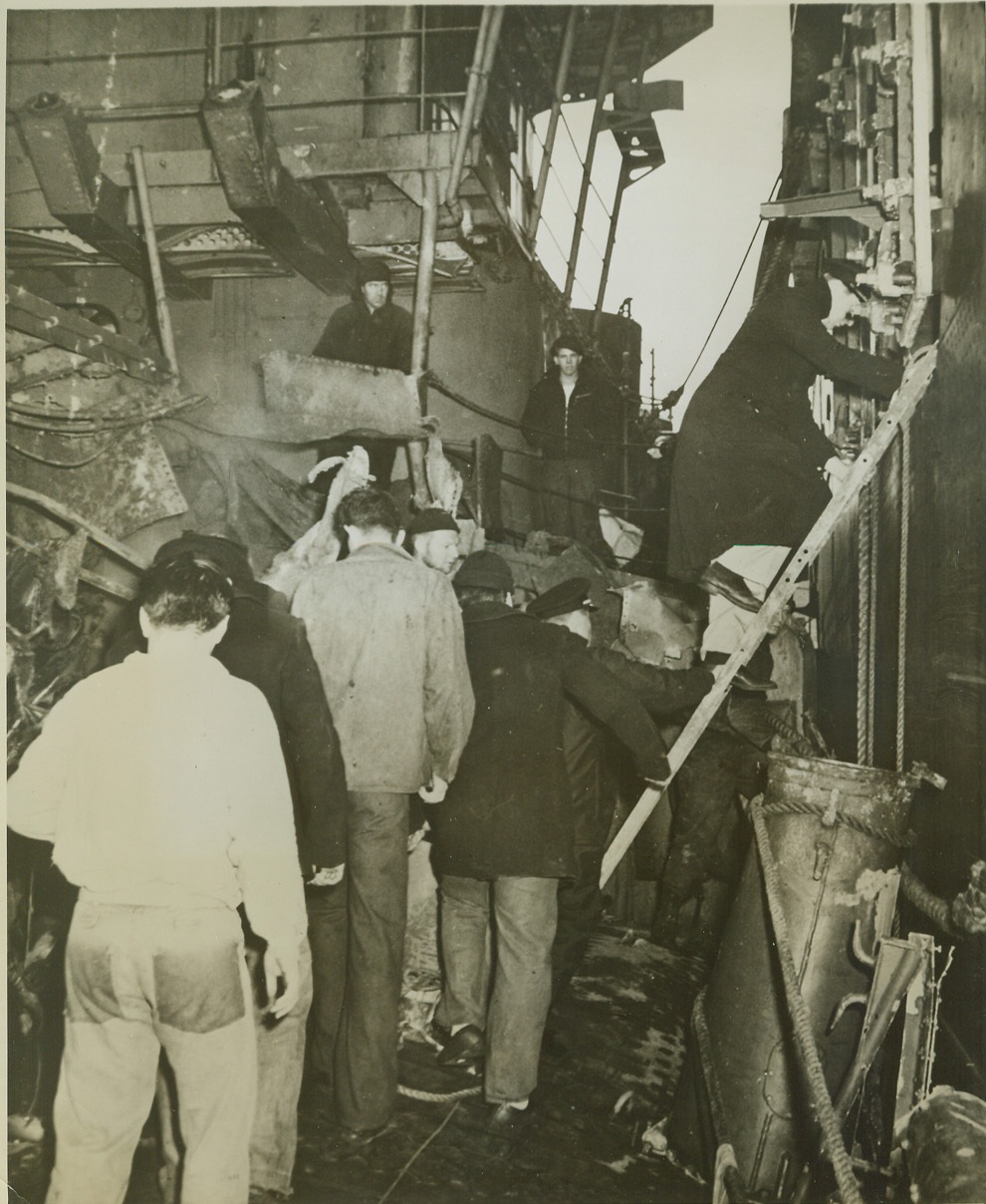 CREW MEMBERS LEAVE DISABLED KEARNY, 10/30/41  WASHINGTON, D.C. – Crew members of the U.S.S. Kearny take leave of their ship to board an accompanying vessel at an unnamed port. The Kearny was damaged by a torpedo while on patrol southwest of Iceland, but was able to limp into port. Credit: OWI Radiophoto from ACME;