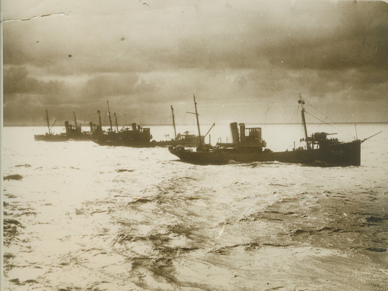 A DANGEROUS WAR TASK, 11/3/1939. A British mine-sweeping flotilla shown at dawn, going about its precarious duties, probably the most dangerous phase of the present war in Europe. Credit: ACME;