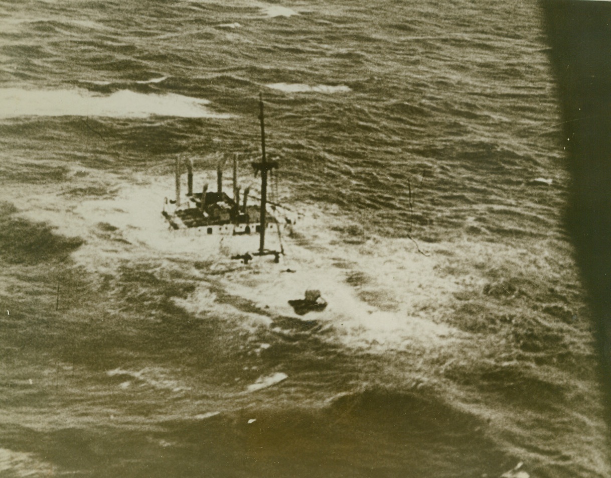 En Route to Davey Jones’ Locker, 12/22/1939. This picture, taken from a German scouting plane, shows a boat sinking in the North Sea. No information was given as to whether the ship struck a mine, was torpedoed or bombed by the planes.Credit (Movietone News from ACME);
