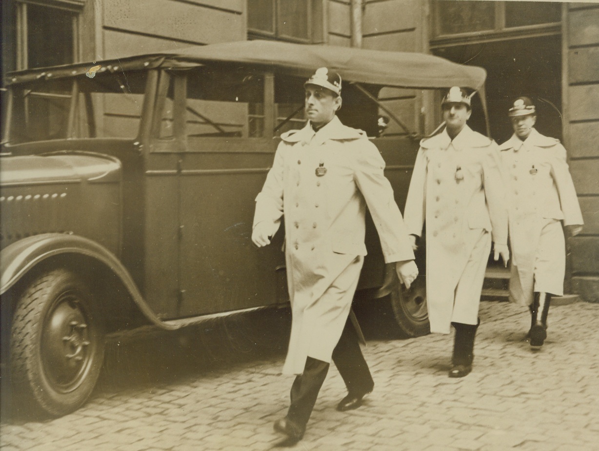 White Coats for Prague Police to Wear in Blackouts. 11/19/1939. PRAGUE – A trio of Prague policemen turning out in their new white coats for wear at night during (blackouts)…coats make police easily seen at night. …speculation as the whether this is to make ….targets or to distinguish from the black….Elite Guards of Herr Himmler, head of the Nazi…in the round up of demonstrating Czechs. Credit (Acme);