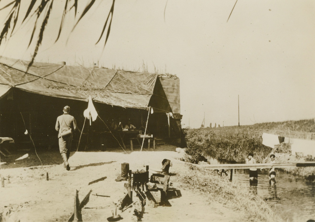 Western Front Bathing, 11/22/1939. On the Western Front – Behind the German fortifications on the Western Front, German soldiers avail themselves of a stream of water to take baths during their off-duty time. Passed by censors. Credit: ACME;